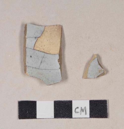 Undecorated tin glaze earthenware body sherds; two sherds crossmend