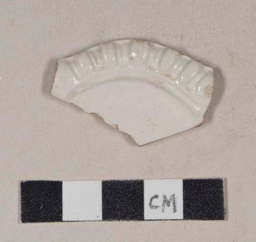 White salt glaze stoneware rim sherd, with molded "gadroon" pattern