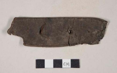 Leather belt or strap fragment, with holes