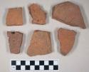 Redware roof tile fragments, one with nail hole