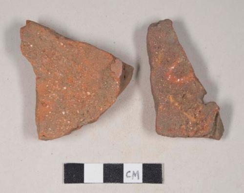 Redware roof tile fragments, one with nail hole