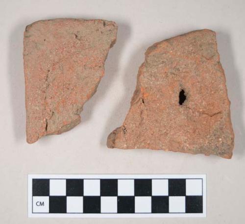 Redware roof tile fragments, one with nail hole