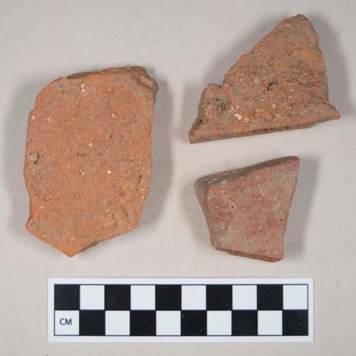 Redware roof tile fragments, one with nail hole
