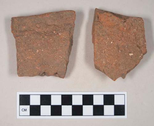 Redware roof tile fragments, one with nail hole