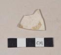 Burned, unidentified refined earthenware body sherd