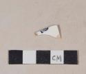 Whiteware body sherd with fragment of black transfer printed makers mark