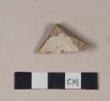 Buff-bodied, buff glazed stoneware rim sherd