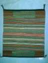 Banded saddle blanket/rug with blocks of stripes at corners