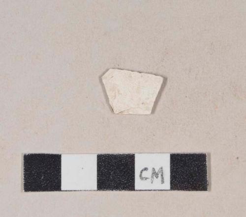 Unidentified refined earthenware body sherd, missing all glaze