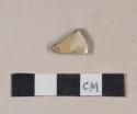 Buff-bodied, bristol glazed stoneware body sherd with yellow slip