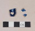 Flow blue pearlware body sherds; two sherds crossmend