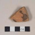 Undecorated, lead glazed redware base sherd