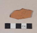 Molded, unglazed redware body sherd