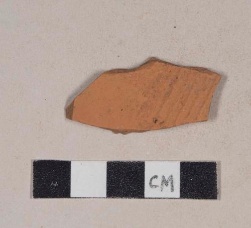 Molded, unglazed redware body sherd