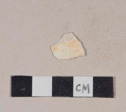 Creamware body sherd with possible orange decoration