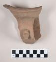 Rim sherd with handle from large pottery vessel
