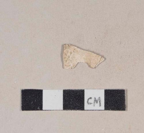 Unidentified refined earthenware body sherd, missing all glaze