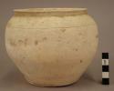 Small pottery urn - chalk-like white ware