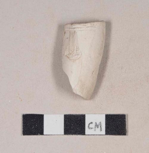 Smoked pipe bowl fragment, with rouletted rim and unidentified cartouche. Crossmends with pipe bowl/stem and bowl fragments 987-22-10/108749 and 987-22-10/108751