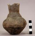 Small long-necked pottery vessel