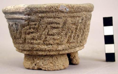 Tripod stone vessel with alligator and serpent motifs.  (mended)