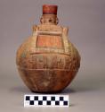Middle Period Northern Coast red-ware: large jar, depicting house people-monkeys