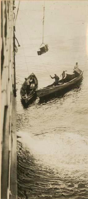 Goods being lowered to canoes