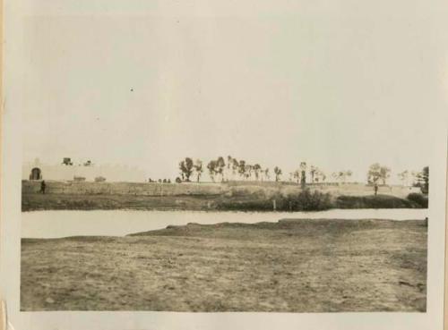 Body of water, with wall in background