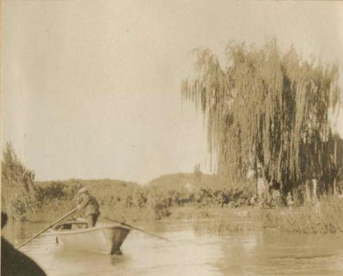 Canoe paddling down a canal