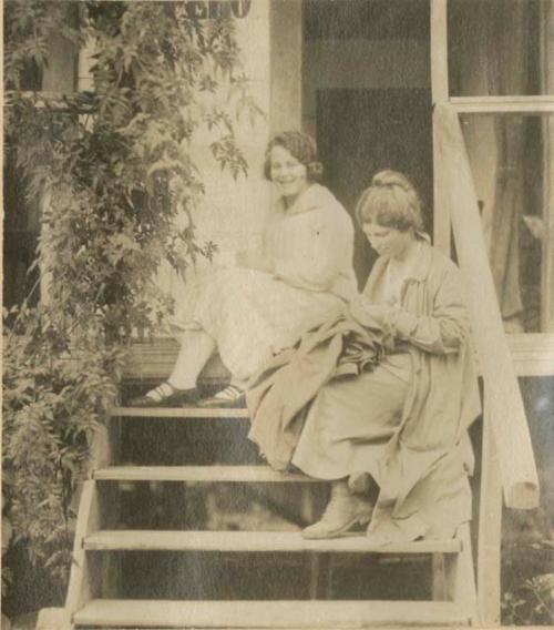 Two women sitting on stairs