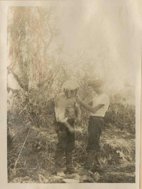 Man putting on protective gear