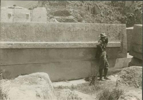 Person and stone walls on a mountainside