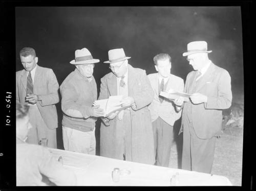 Colonel Hoogenhout standing with Laurence Marshall and other expedition members