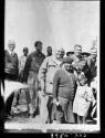 Queen Moremi and one of the princes standing with Laurence Marshall