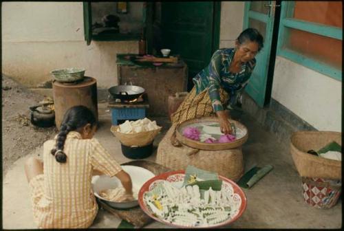 Preparing kue for temple offerings