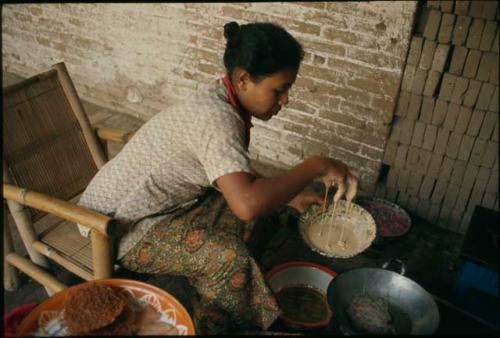 Preparing kue for temple offerings