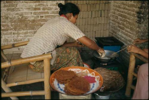 Preparing kue for temple offerings