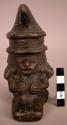 Ceramic figurine, moulded and incised human figure with headdress
