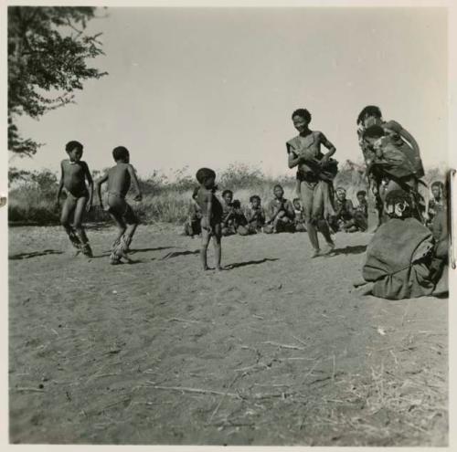 /Naoka ("Gao Medicine's" first wife) and boys dancing, with a group of women singing behind them