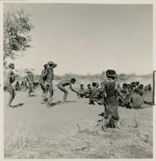 Men entering a curing dance