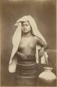 Studio portrait of Mixtec woman with arm drapped over chair