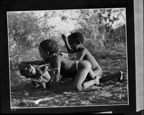 /Gaishay (son of Di!ai and "Gao Medicine"), Bau (daughter of "Crooked /Qui" and //Khuga), and "Little ≠Gao" (son of "/Qui Navel" and //Kushay) dancing a medicine dance, with /Gaishay having fallen in trance