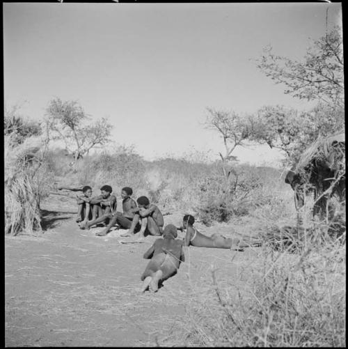 "/Gao Music" playing the //guashi, with //Ao and others singing and "≠Gao Lame" lying down