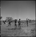 Boys playing a game with John Marshall in camp