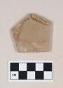 Buff bodied earthenware body sherd, with red slipped decoration