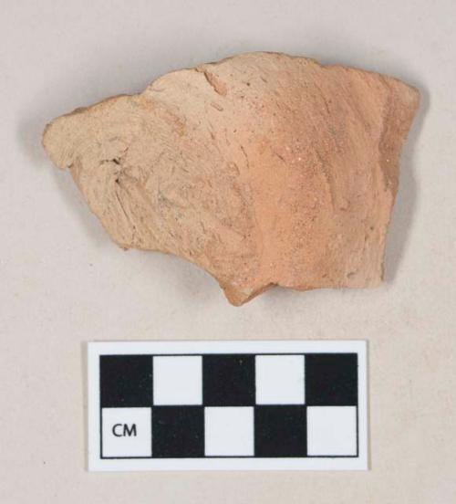 Coarse red bodied earthenware base sherd, unslipped