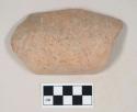 Coarse red bodied earthenware rim sherd, with red slip, reduced core