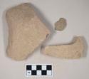 Coarse buff bodied earthenware body sherds, unslipped; two sherds crossmend