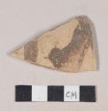 Buff bodied earthenware rim sherd, with buff slip and brown slipped design