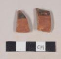 Red bodied earthenware body sherds, with red slip and black slipped stripes; two sherds crossmend
